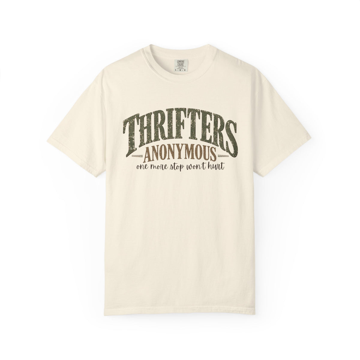 An off-white short-sleeve t-shirt with a distressed dark green graphic on the front that reads 'THRIFTERS ANONYMOUS' and 'one more stop won't hurt'.