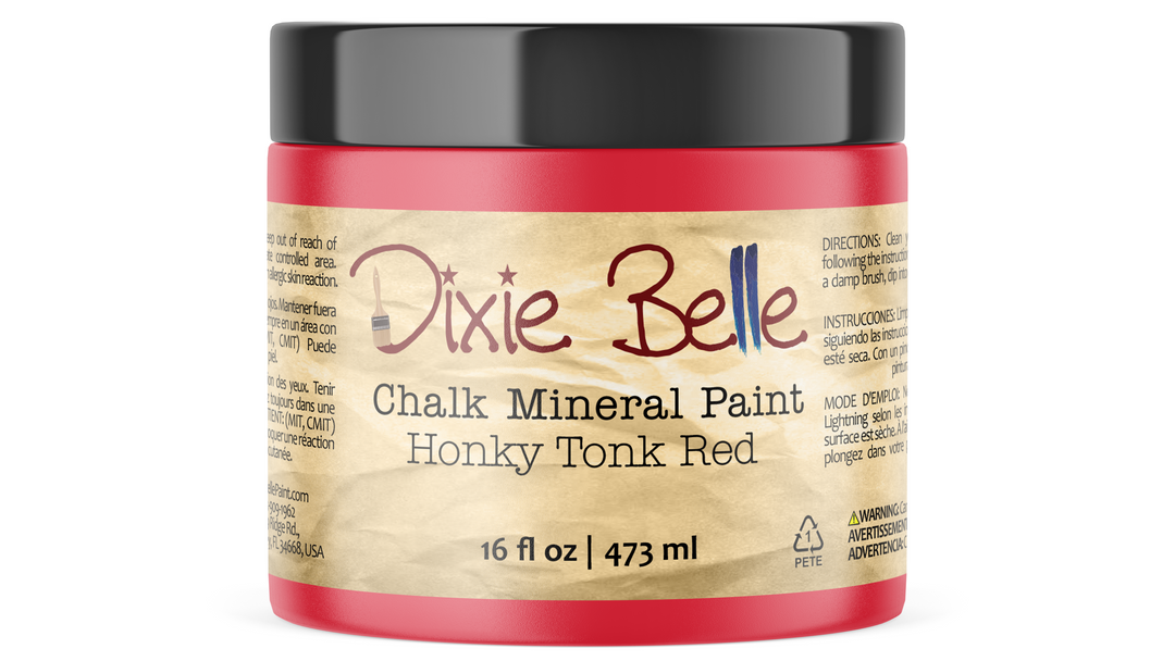 Jar of Dixie Belle Chalk Mineral Paint in Honey Tonk Red on a white background