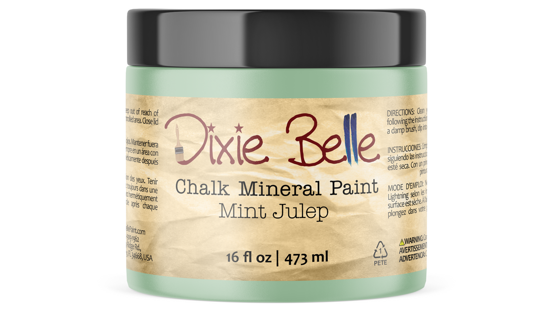 A 16 fl oz jar of Dixie Belle Chalk Mineral Paint in the scent Mint Julep, featuring a light mint green container, a black lid, and a tan paper label.