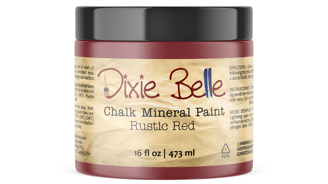 A 16 fl oz jar of Dixie Belle Chalk Mineral Paint in the color Rustic Red, featuring a black lid and a beige label with red and black text.