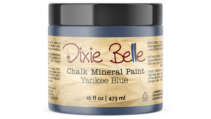 Jar of Dixie Belle Chalk Mineral Paint in Yankee Blue on a white background