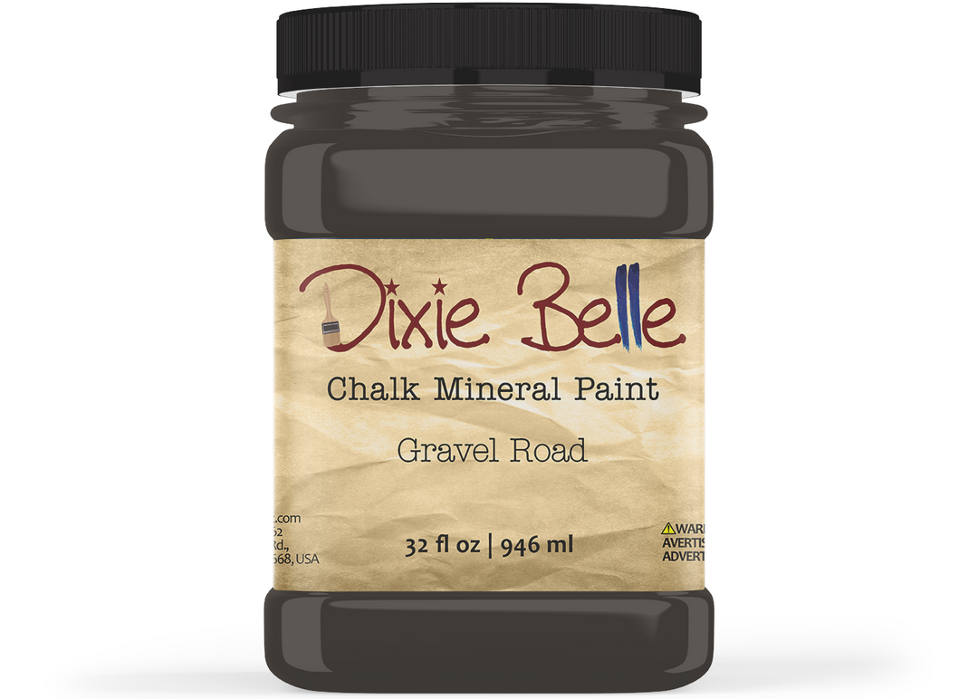 A jar of Dixie Belle Chalk Mineral Paint in the color Gravel Road, featuring a black lid and a beige textured label on a white background.