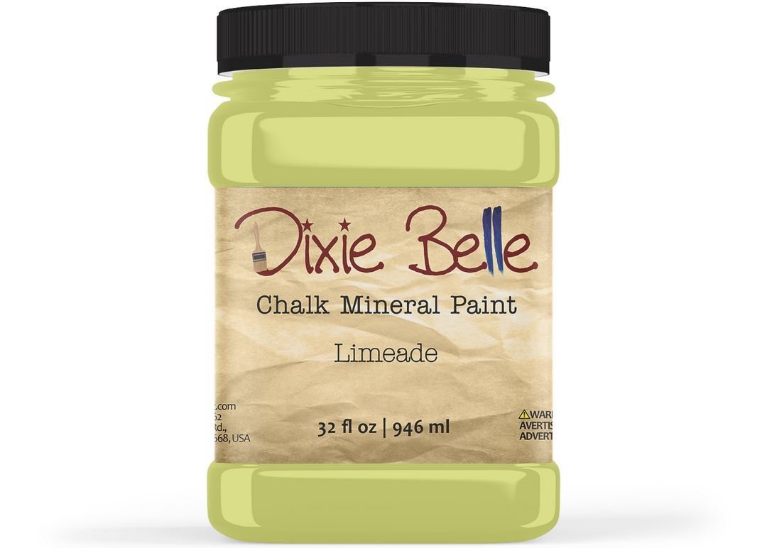 A jar of Dixie Belle Chalk Mineral Paint in the shade Limeade, featuring a black lid and a beige textured label, set against a plain white background.