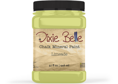A jar of Dixie Belle Chalk Mineral Paint in the shade Limeade, featuring a black lid and a beige textured label, set against a plain white background.