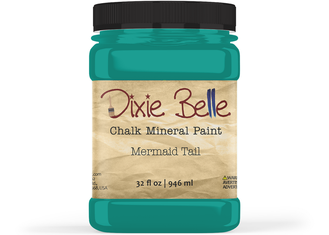 A jar of Dixie Belle Chalk Mineral Paint in the shade Mermaid Tail, featuring a black lid and a beige label, shown on a white background.