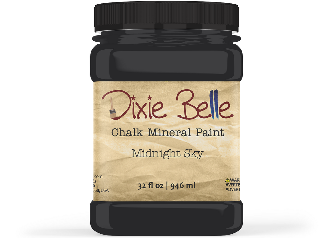 A jar of Dixie Belle Chalk Mineral Paint in the color 'Midnight Sky', featuring a black plastic jar and a beige textured label with the brand name in red and black text.