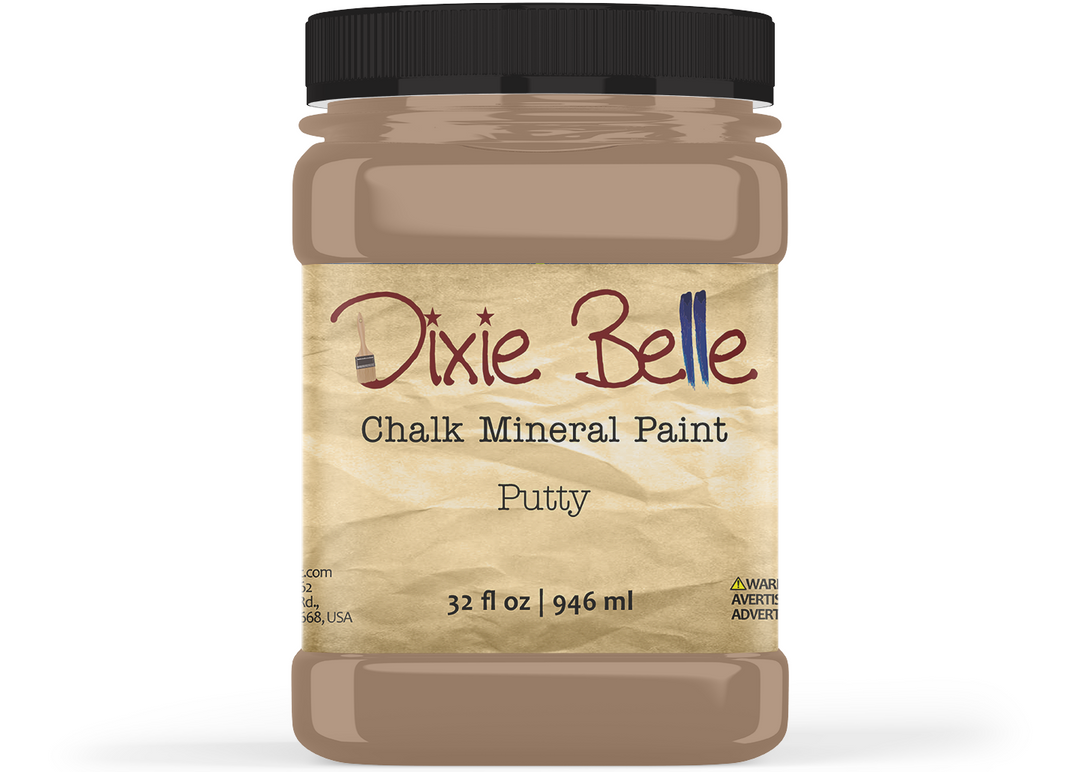 A jar of Dixie Belle Chalk Mineral Paint in the color Putty, featuring a black screw cap and a textured beige label on a white background.
