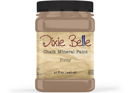A jar of Dixie Belle Chalk Mineral Paint in the color Putty, featuring a black screw cap and a textured beige label on a white background.