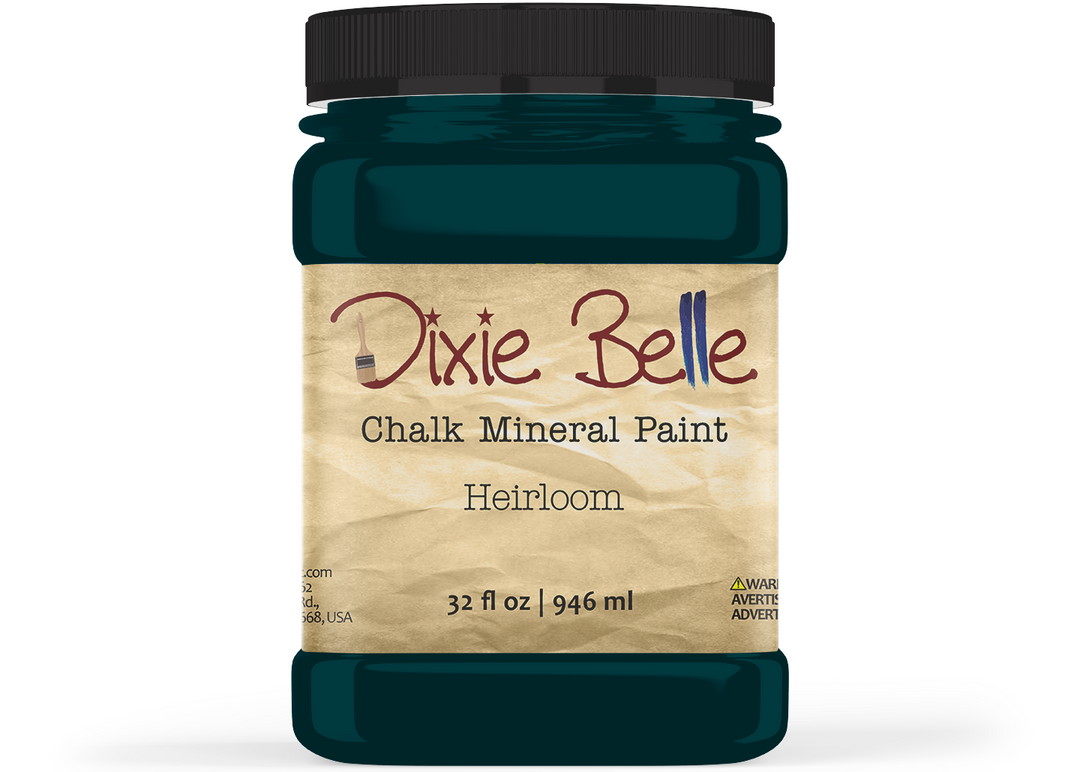 A jar of Dixie Belle Chalk Mineral Paint in the Heirloom color, featuring a black lid and a beige textured label, shown on a white background.
