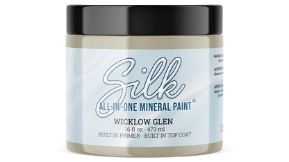 A 16oz. jar of Silk All-In-One Mineral Paint in the color Wicklow Glen, featuring a light blue and white label with a black lid, on a white background.