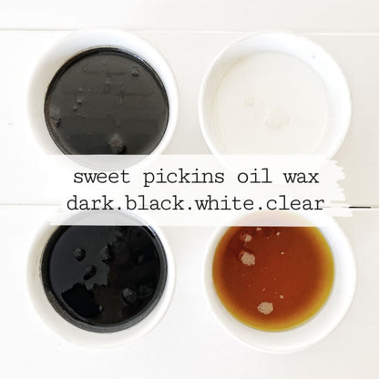 Four containers of oil wax in dark, black, white, and clear on a white background with 'sweet pickins oil wax' text.