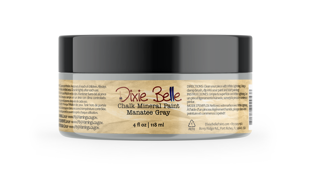 A jar of Dixie Belle Chalk Mineral Paint in the color Manatee Gray, featuring a black lid and a beige label with product details.