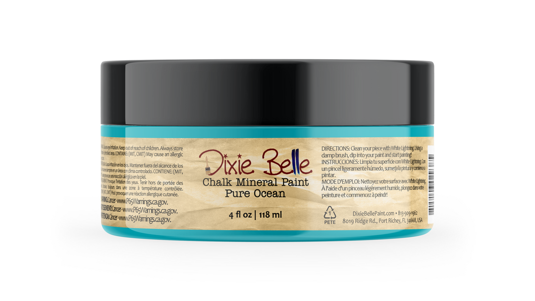 A 4 fl oz jar of Dixie Belle Chalk Mineral Paint in the color 'Pure Ocean', featuring a turquoise and beige label with a black lid, on a white background.