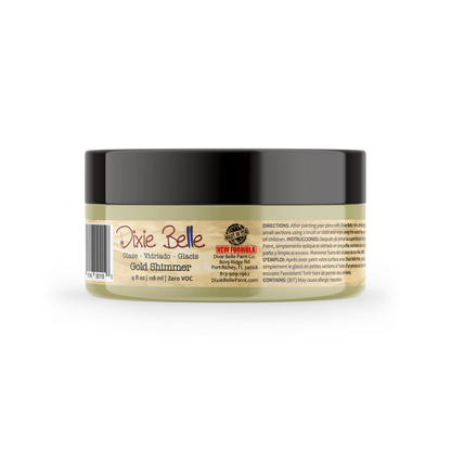 A jar of Dixie Belle Gold Shimmer glaze, showing the side label with directions and barcode against a white background.