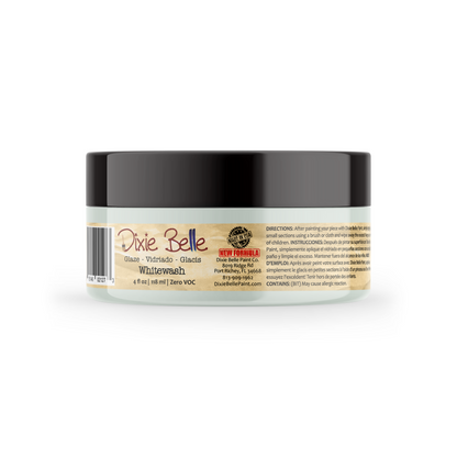 A jar of Dixie Belle Whitewash glaze, featuring a black lid and a beige label with product details, shown on a white background.