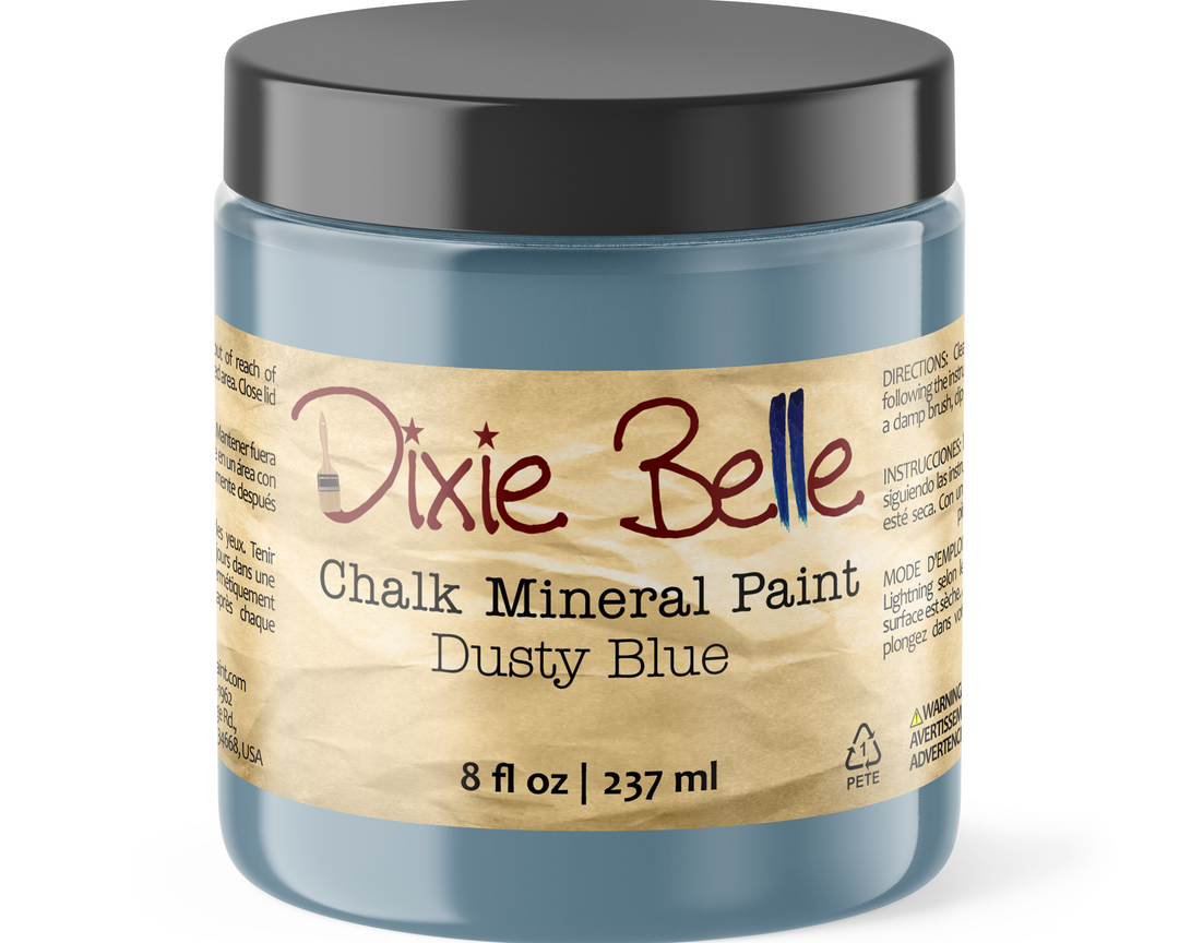 Jar of Dixie Belle Chalk Mineral Paint in Dusty Blue on a white background