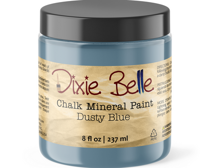 Jar of Dixie Belle Chalk Mineral Paint in Dusty Blue on a white background