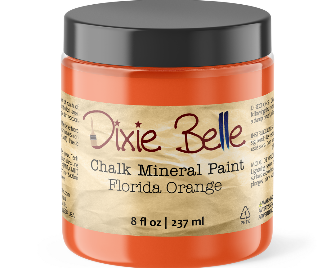 Jar of Dixie Belle Chalk Mineral Paint in Florida Orange on a white background