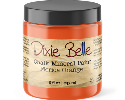 Jar of Dixie Belle Chalk Mineral Paint in Florida Orange on a white background