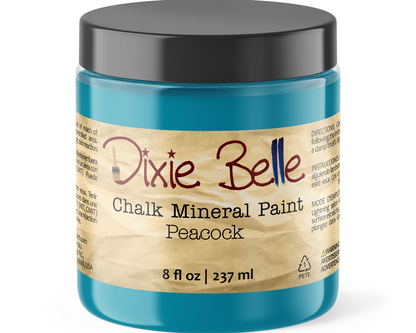 Jar of Dixie Belle Chalk Mineral Paint in Peacock color on a white background