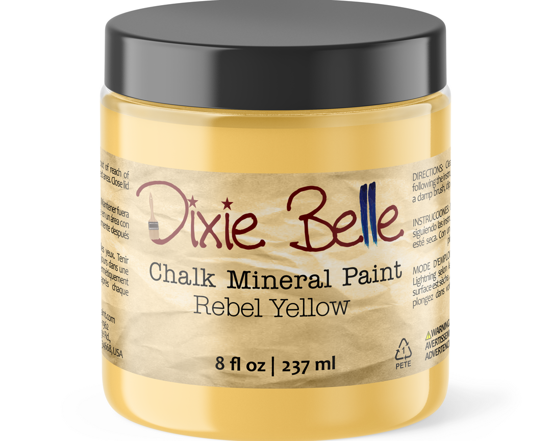 Jar of Dixie Belle Chalk Mineral Paint in Rebel Yellow on a white background