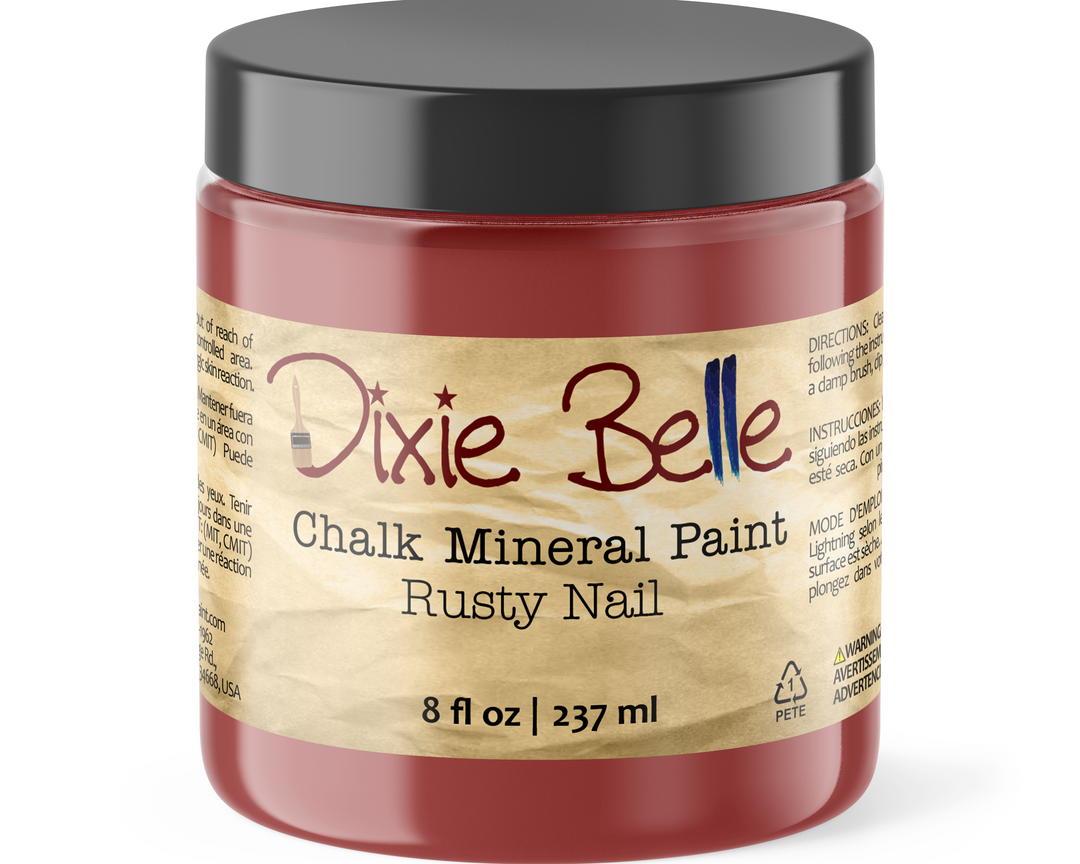 Jar of Dixie Belle Chalk Mineral Paint in Rusty Nail color on a white background