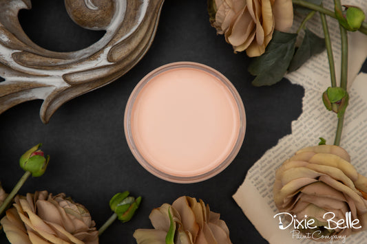 apricot paint on a dark surface with decorative elements and flowers