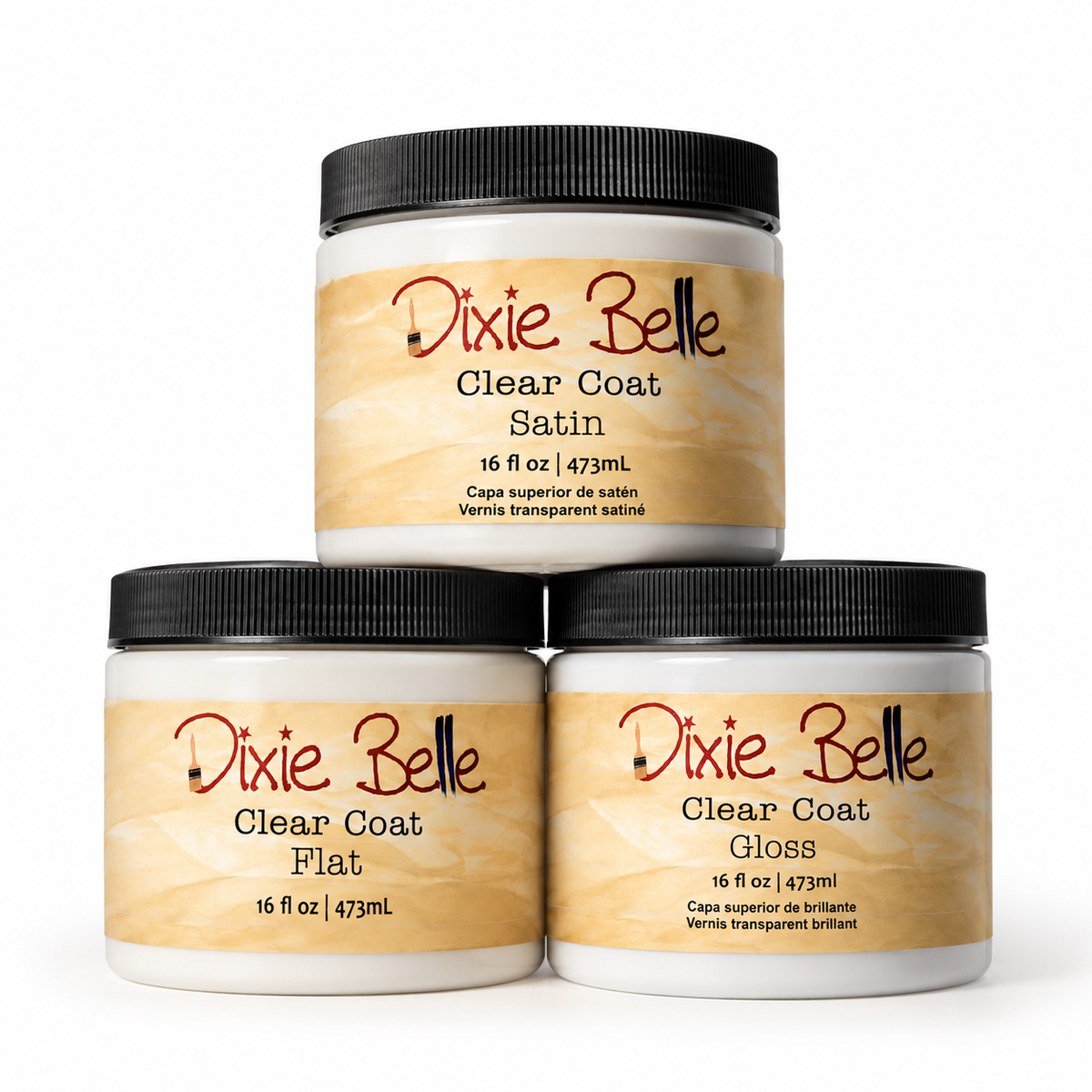 Three jars of Dixie Belle Clear Coat varnish arranged in a pyramid on a white background. The top jar is labeled Satin, and the two bottom jars are labeled Flat and Gloss.