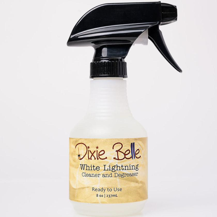 Spray bottle labeled 'Dixie Belle White Lightning' on a white background