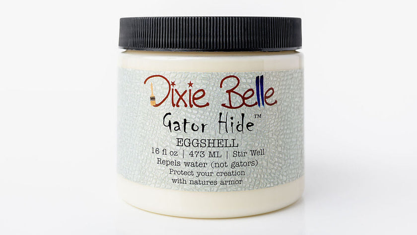 A jar of Dixie Belle Gator Hide Eggshell resin, featuring a textured light blue label and a black ribbed screw cap, set against a plain white background.