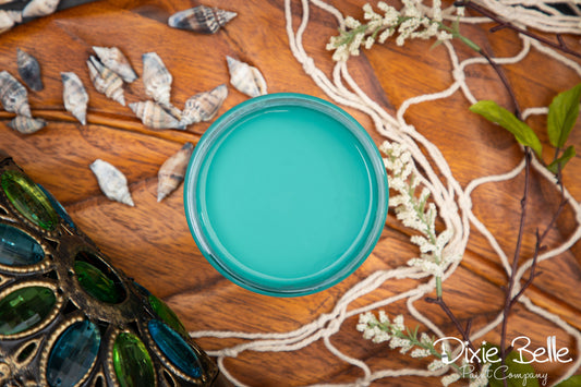 Dixie Belle Paint color Mermaid Tail on a wooden surface with decorative elements