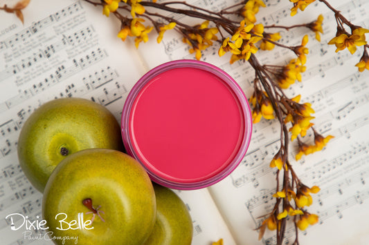 Dixie Belle Paint color Peony with green apples and yellow flowers on a sheet of music, featuring 'Dixie Belle' branding.