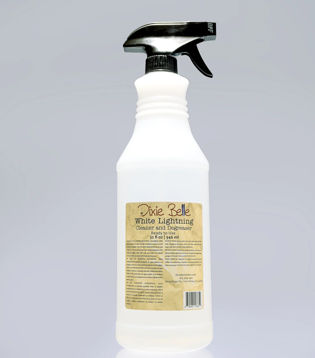 A white plastic spray bottle with a black trigger sprayer and a tan label reading Dixie Belle White Lighting Cleanse Acid Engraver, shown on a light gray background.