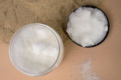 Two containers with white lightening concentrate on a beige surface