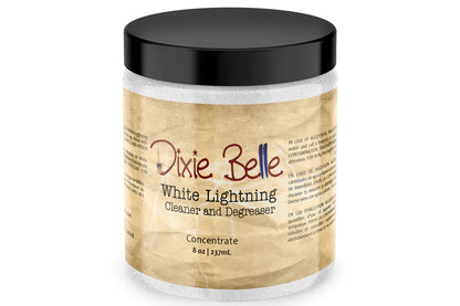 A jar of Dixie Belle White Lightning Cleaner and Degreaser concentrate, featuring a black lid and a beige textured label, set against a plain white background.