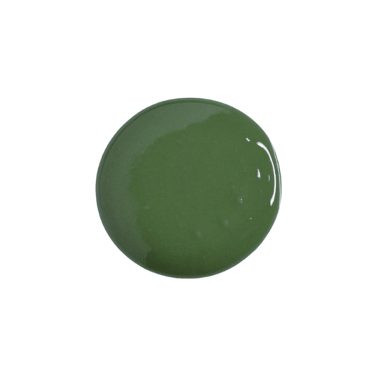 A glossy, circular swatch of olive green paint or pigment on a solid white background.