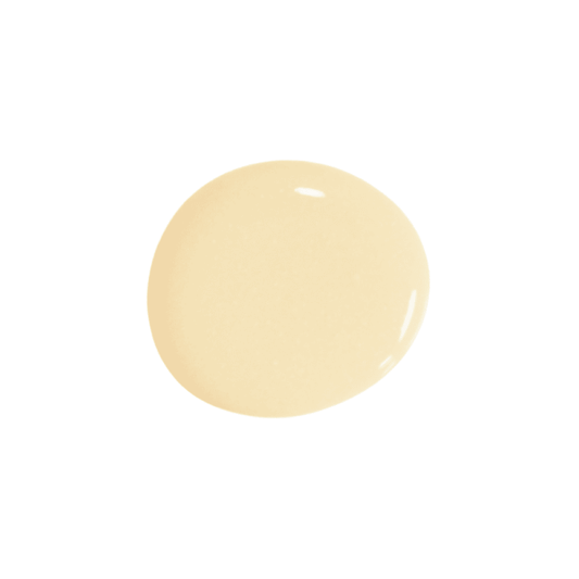 A drop of butter paint on a solid white background.