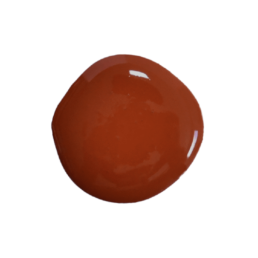 a drop of cherry pie milk paint on a white background