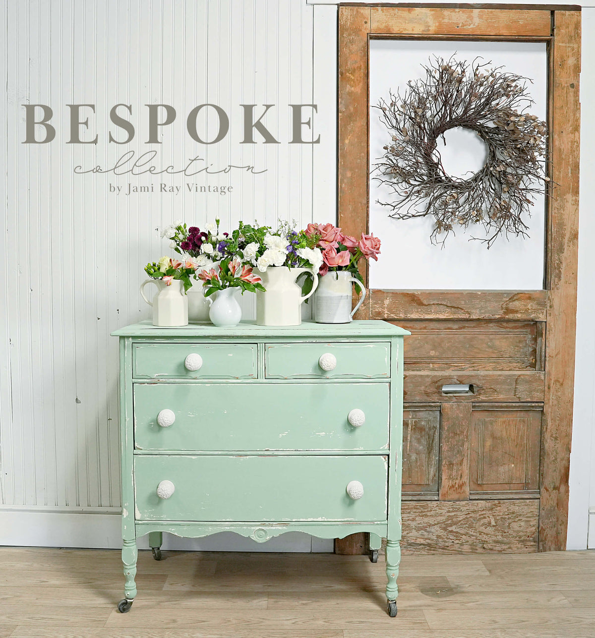 Vintage-style dresser with flowers in a rustic interior setting, featuring the 'Bespoke Collection' by Jami Ray Vintage.