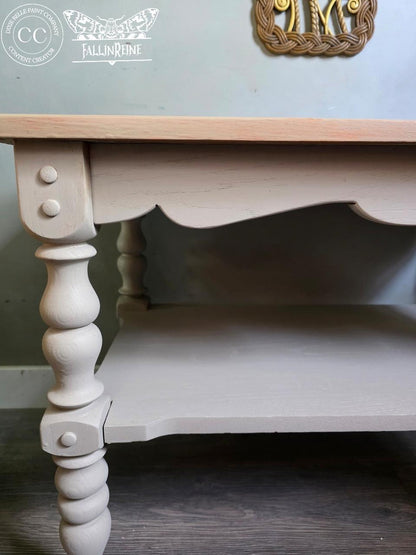 Wooden table with white painted base and scalloped edge
