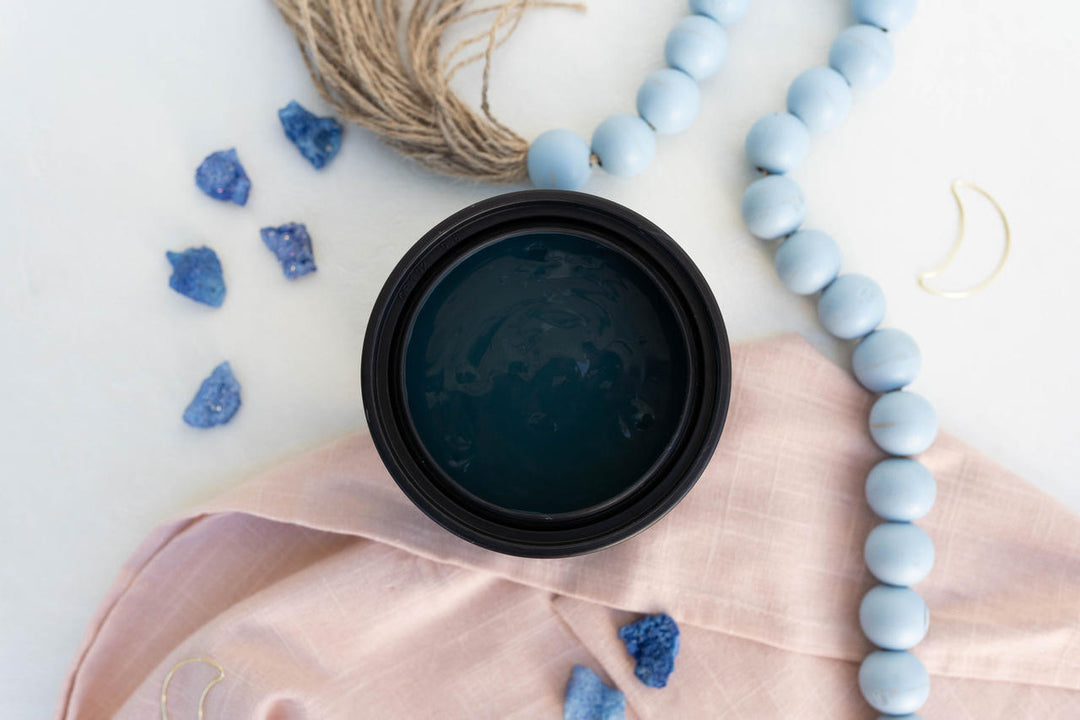 Galaxy Terra Clay Paint, styled on a white surface with a pink cloth, light blue beads, small blue crystals, and twine.