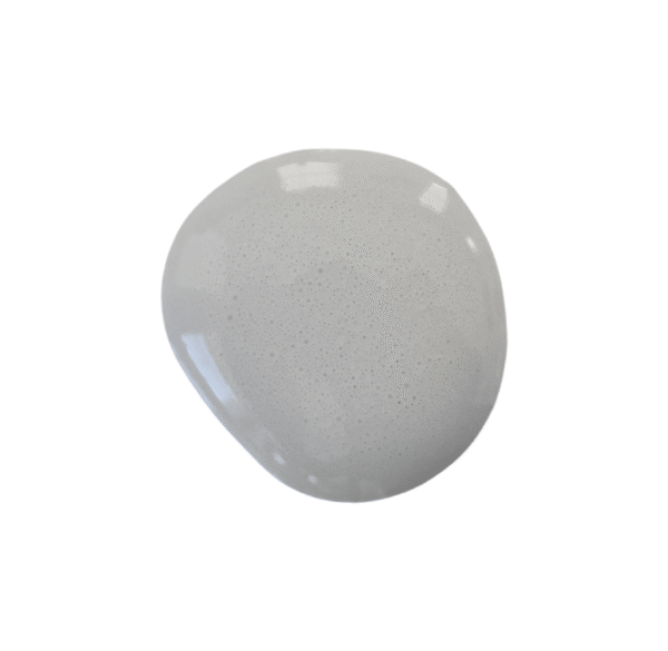 a drop of galvanized milk paint on a solid white background.