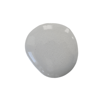 a drop of galvanized milk paint on a solid white background.