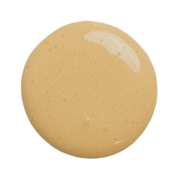 a drop of hollandaise milk paint on a white background
