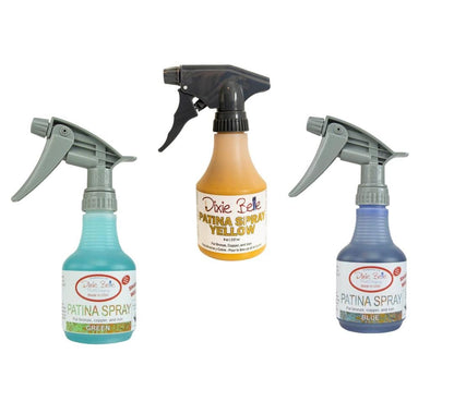Three bottles of Patina Spray on a white background