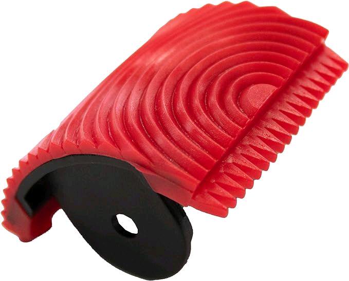 Red and black plastic strip with textured surface on a white background