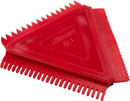 Red plastic tool with a textured surface on a white background