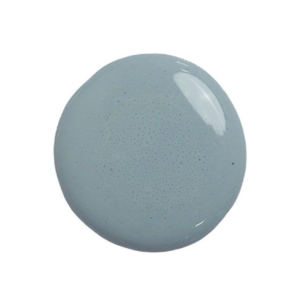 a drop of kent milk paint on a white background