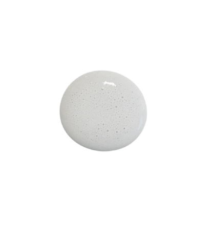 a drop of mercantile milk paint on a white background