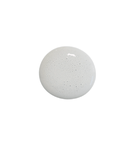 a drop of mercantile milk paint on a white background